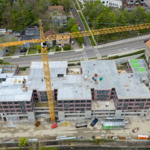 Construction with pre-fabricated light-gauge structural panel system.